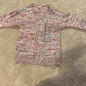 Girls pink, blue, and white sweater.